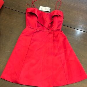 New dress w tags. Small stain on back